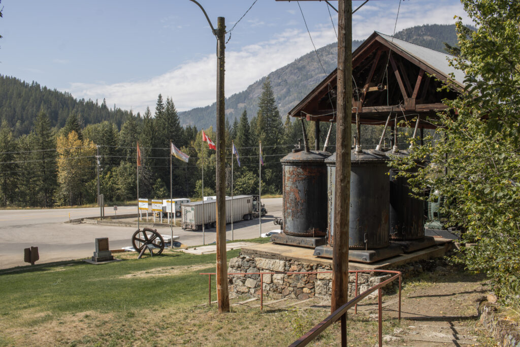 Exterior of the Rossland Museum & Discovery Centre with outdoor exhibits and scenic views of the West Kootenays in British Columbia.
