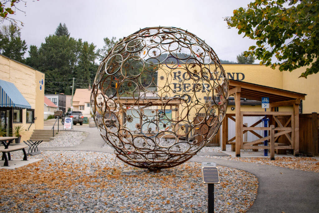 Public art sculpture made from recycled bike parts along the Rossland Art Walk in British Columbia.